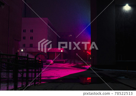 City buildings brightly lit in purple, red and blue 78522513