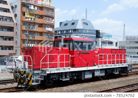 HD300 hybrid locomotive parked at Hachioji Station 78524702