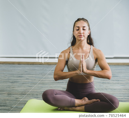 Caucasian woman exercise doing the yoga pose stretching at home, healthy lifestyle concept Caucasian woman exercise doing the yoga pose stretching at home, healthy lifestyle concept 78525464