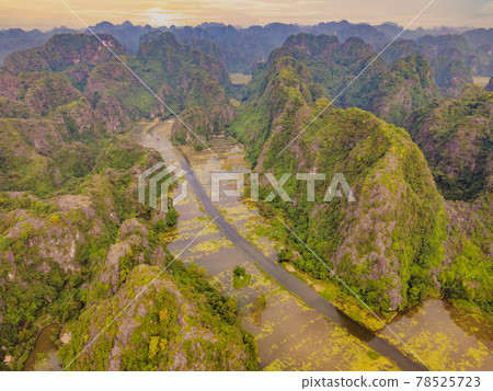 the majestic scenery on Ngo Dong river in Tam Coc Bich Dong view from drone in Ninh Binh province of Viet Nam the majestic scenery on Ngo Dong river in Tam Coc Bich Dong view from drone in Ninh Binh province of Viet Nam 78525723