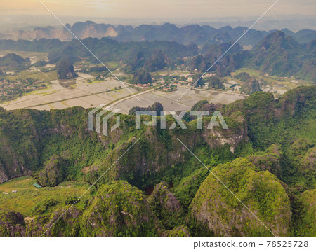the majestic scenery on Ngo Dong river in Tam Coc Bich Dong view from drone in Ninh Binh province of Viet Nam the majestic scenery on Ngo Dong river in Tam Coc Bich Dong view from drone in Ninh Binh province of Viet Nam 78525728
