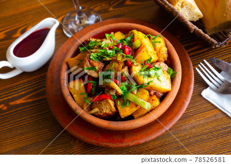Traditional georgian Ojakhuri with pomegranate in earthenware ketsi pan Traditional georgian Ojakhuri with pomegranate in earthenware ketsi pan 78526581