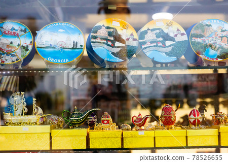 Colorful ceramic plates on showcase of Georgian gift shop Colorful ceramic plates on showcase of Georgian gift shop 78526655
