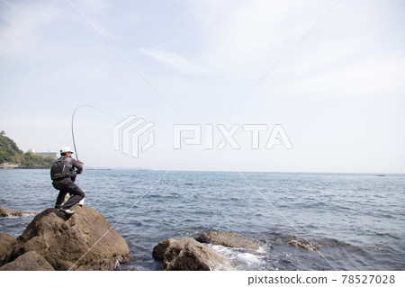 Man fishing on the rocks Man fishing on the rocks 78527028