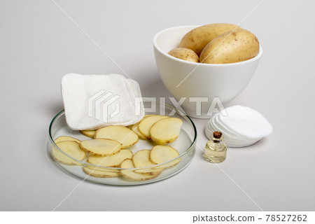 Sliced Potatoes prepared for cosmetic procedures. 78527262