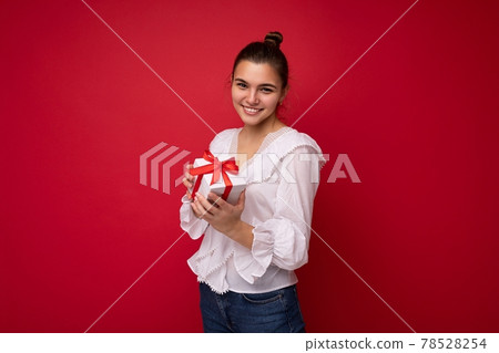 Shot of attractive positive smiling young brunette woman isolated over colourful background wall 78528254