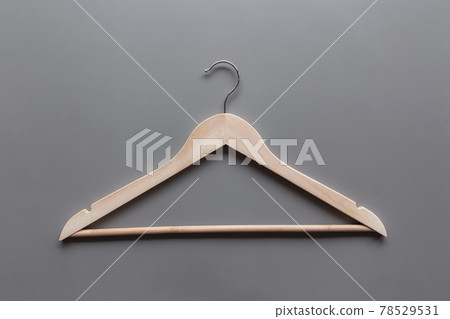 Black Friday or clothing industry concept on gray background with wooden hanger Black Friday or clothing industry concept on gray background with wooden hanger 78529531