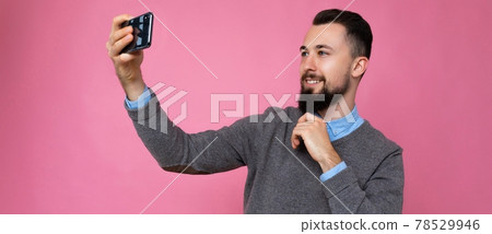 panoramic photo of Handsome young man wearing casual stylish clothes standing isolated over panoramic photo of Handsome young man wearing casual stylish clothes standing isolated over 78529946
