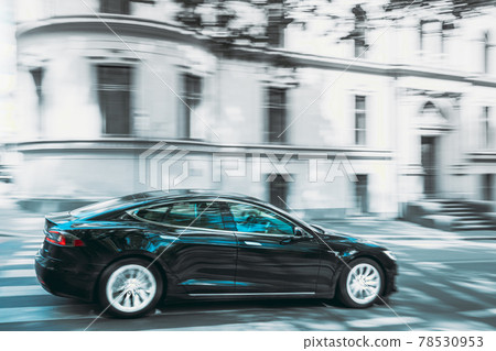 Black Color Tesla Model S 100d Car Fast Drive In Summer City Street. The Tesla Model S Is A Full-sized All-electric Five-door, Luxury Liftback, Produced By Tesla Inc. All Colors Except Red And Blue 78530953