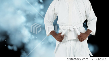 Composition of midsection of african american male martial artist with black belt 78532314
