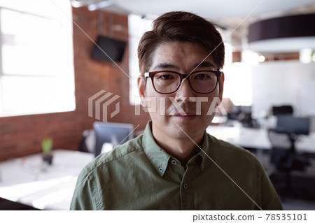 Portrait of serious asian businessman standing in office looking to camera 78535101