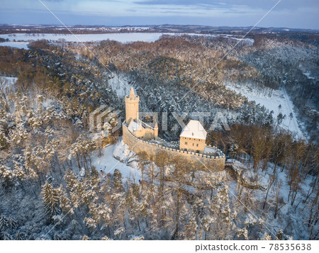 Aerial view of medieval castle Kokorin in winter during sunrise. National park Kokorinsko nearby Prague in Czech Republic. Central Europe. 78535638