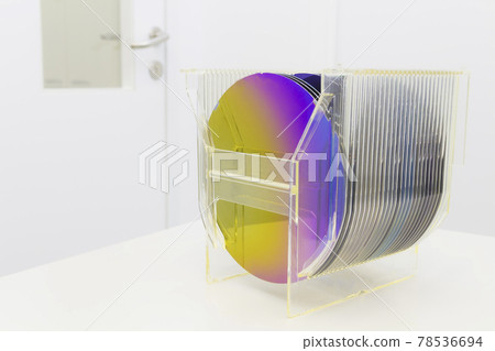 Silicon Wafers in plastic storage box in clear room of semiconductor foundry. Silicon Wafers in plastic storage box in clear room of semiconductor foundry. 78536694
