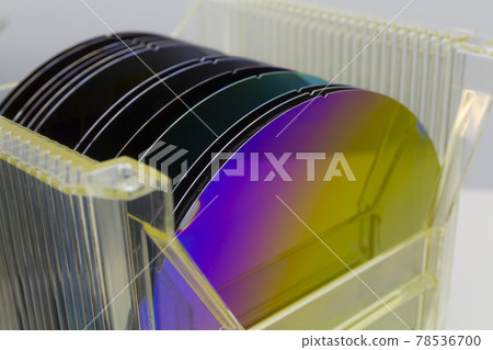 Silicon Wafers in plastic storage box in clear room of semiconductor foundry. 78536700