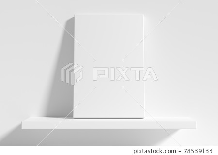 Rectangular poster on white shelf leaning at wall Rectangular poster on white shelf leaning at wall 78539133