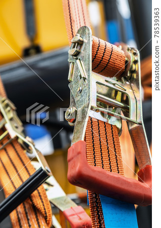 tension safety belts with mechanical locks. stretch textile slings hold 78539363