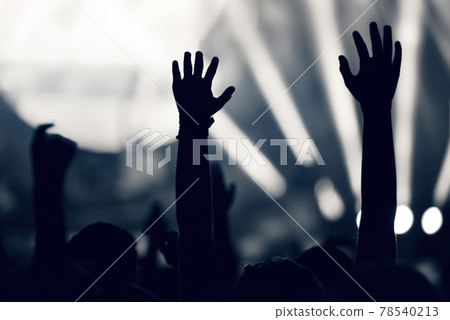 Crowd at a music concert, audience raising hands up, toned Crowd at a music concert, audience raising hands up, toned 78540213