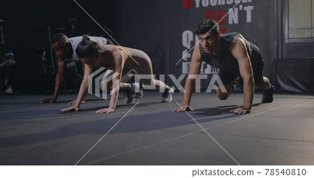 Three group muscular young Caucasian man and Asian woman doing laughing exercise workout physique bodybuilders training Three group muscular young Caucasian man and Asian woman doing laughing exercise workout physique bodybuilders training 78540810