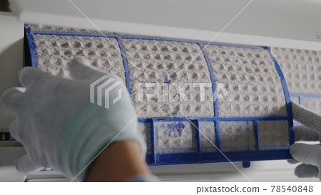 Hand of technician man working pulling dusty filter from air conditioner Hand of technician man working pulling dusty filter from air conditioner 78540848