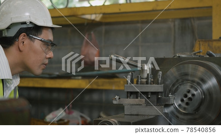 professional mechanical engineer or operation man wear uniform goggles safety working on workshop metal lathe industrial professional mechanical engineer or operation man wear uniform goggles safety working on workshop metal lathe industrial 78540856