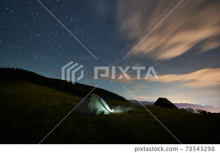 Scenery of tent near forest at night. Scenery of tent near forest at night. 78543298