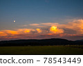 Clouds and the moon in the sunset 78543449