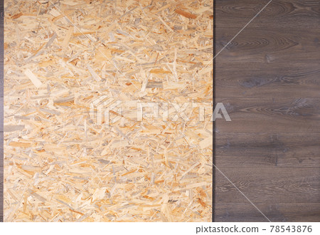 Chipboard background texture. Wooden osb surface at wood laminate floor Chipboard background texture. Wooden osb surface at wood laminate floor 78543876
