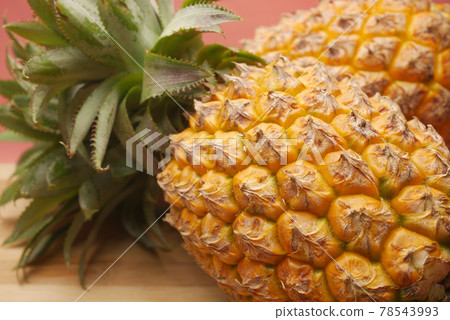 close up of fresh Pineapple in bowl on table  78543993