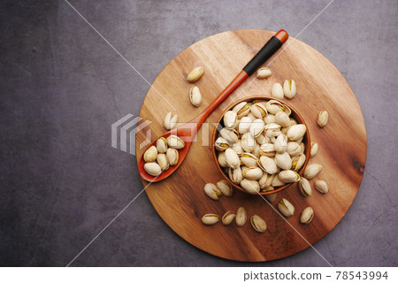 cashew nut in a bowl on black background cashew nut in a bowl on black background 78543994