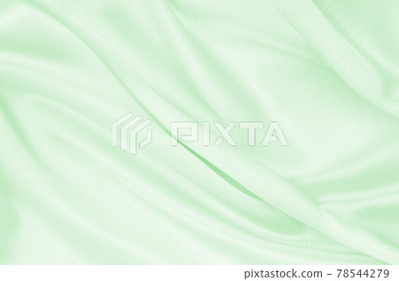 Smooth elegant green silk or satin luxury cloth texture as abstract background. Luxurious background design 78544279