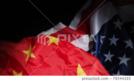 USA and China flag on black background. Represent serious trade tension or trade war between America and China. financial concept. Flags of China and the United States of America on Black. top view an USA and China flag on black background. Represent serious trade tension or trade war between America and China. financial concept. Flags of China and the United States of America on Black. top view an 78544285