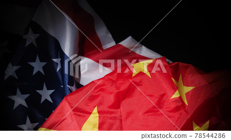 USA and China flag on black background. Represent serious trade tension or trade war between America and China. financial concept. Flags of China and the United States of America on Black. top view an USA and China flag on black background. Represent serious trade tension or trade war between America and China. financial concept. Flags of China and the United States of America on Black. top view an 78544286