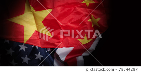 USA and China flag on black background. Represent serious trade tension or trade war between America and China. financial concept. Flags of China and the United States of America on Black. top view an USA and China flag on black background. Represent serious trade tension or trade war between America and China. financial concept. Flags of China and the United States of America on Black. top view an 78544287
