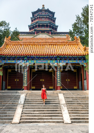 China travel lifestyle Asia summer tourism. Famous china destination. Chinese woman tourist visiting traditional religious temple in Beijing city 78547141