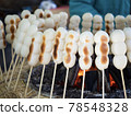Charcoal grilled skewers of dumplings 78548328