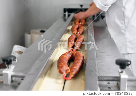 Sausages. Packing line of sausages. Industrial manufacture of sausage products. Sausages. Packing line of sausages. Industrial manufacture of sausage products. 78548552