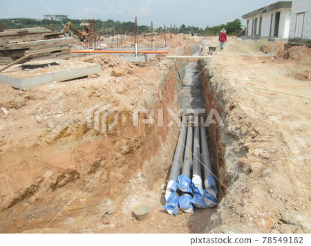SEREMBAN, MALAYSIA -FEBRUARY 24, 2017: Underground utility and services pipe lay by workers at the construction site.   78549182