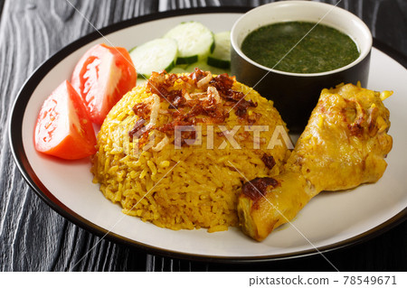 Tasty Khao Mok Gai Thai Rice and Chicken Biryan closeup in the plate. Horizontal 78549671