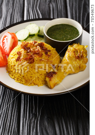 Khao Mok Gai Thai Chicken With Rice closeup in the plate. Vertical 78549673