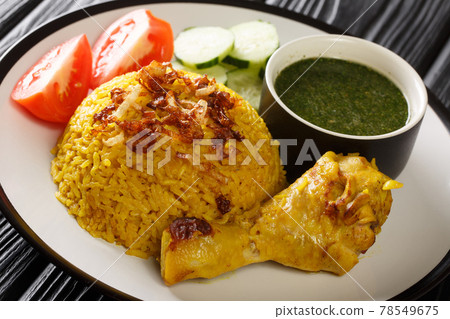 Thai Style Chicken Biryani Recipe Khao Mok Gai closeup in the plate. Horizontal 78549675