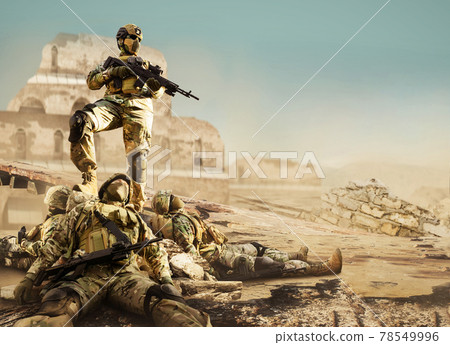 Soldier standing on rock with fallen warriors. Soldier standing on rock with fallen warriors. 78549996