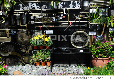 PUTRAJAYA, MALAYSIA -MAY 30, 2016: Small pocket garden made from mix of recycle material and mix of flower at Floria Garden, Putrajaya, Malaysia. PUTRAJAYA, MALAYSIA -MAY 30, 2016: Small pocket garden made from mix of recycle material and mix of flower at Floria Garden, Putrajaya, Malaysia. 78550094