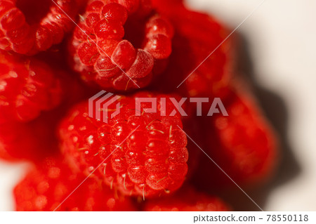 Juicy raspberries in macro. Juicy raspberries in macro. 78550118