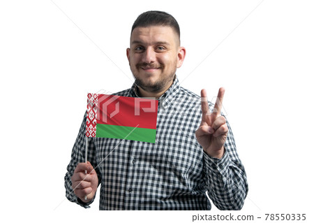 White guy holding a flag of Belarus and shows two fingers isolated on a white background White guy holding a flag of Belarus and shows two fingers isolated on a white background 78550335