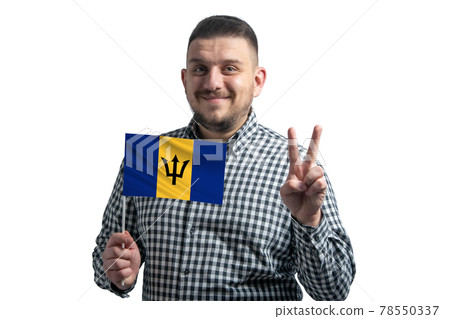 White guy holding a flag of Barbados and shows two fingers isolated on a white background 78550337