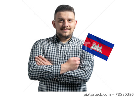 White guy holding a flag of Cambodia smiling confident with crossed arms isolated on a white background White guy holding a flag of Cambodia smiling confident with crossed arms isolated on a white background 78550386