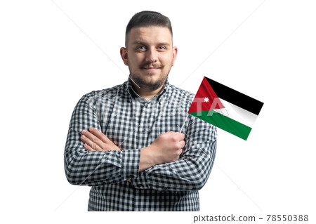 White guy holding a flag of Jordan smiling confident with crossed arms isolated on a white background 78550388