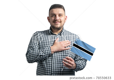 White guy holding a flag of Botswana and holds his hand on his heart isolated on a white background With love to Botswana White guy holding a flag of Botswana and holds his hand on his heart isolated on a white background With love to Botswana 78550633