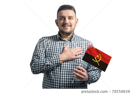 White guy holding a flag of Angola and holds his hand on his heart isolated on a white background With love to Angola White guy holding a flag of Angola and holds his hand on his heart isolated on a white background With love to Angola 78550639
