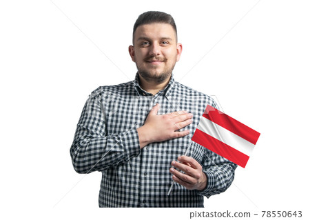 White guy holding a flag of Austria and holds his hand on his heart isolated on a white background With love to Austria White guy holding a flag of Austria and holds his hand on his heart isolated on a white background With love to Austria 78550643